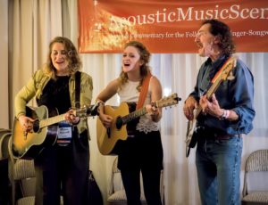 Kirsten Maxwell, Alice Howe and Freebo showcase their talents in the AcousticMusicScene.com suite during the 2017 NERFA Conference (Photo: Jake Jacobson)
