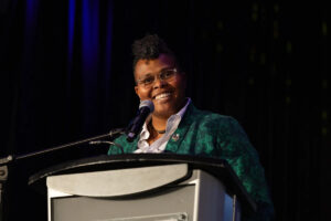 Crys Matthews accepts the Artist of the Year award during the 2025 International Folk Music Awards show. (Photo:Indie Montreal, courtesy of FAI)